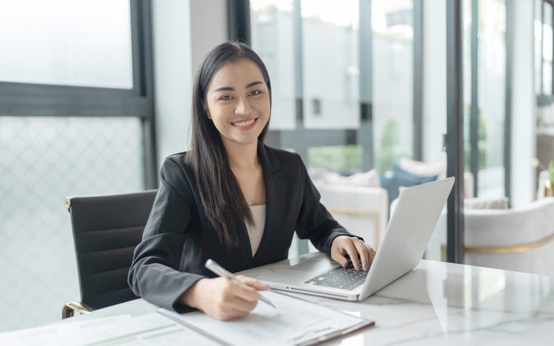 beautiful-confident-asian-business-woman-working-with-laptop-hands-typing-keyboard-professional-investor-working-new-start-up-project-business-planning-office-technology-business-min