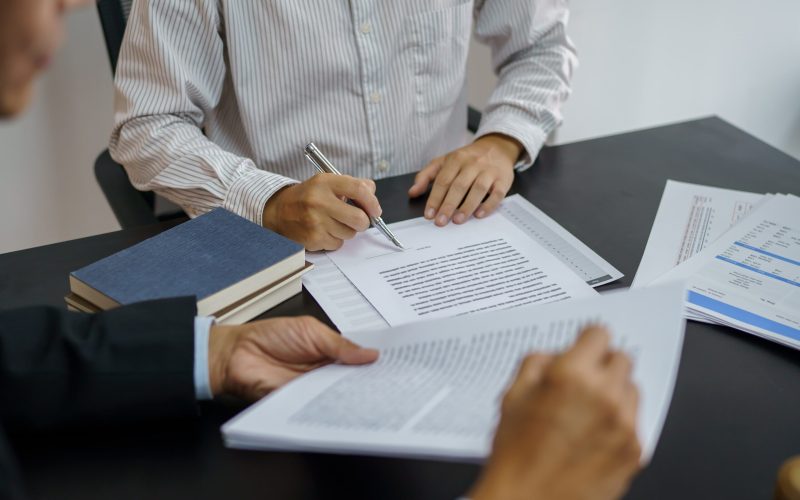 legal-counsel-presents-client-signed-contract-with-gavel-legal-law-justice-lawyer-concept-min