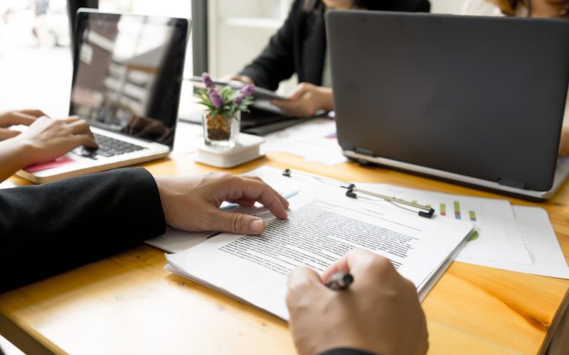 midsection-man-writing-table-min